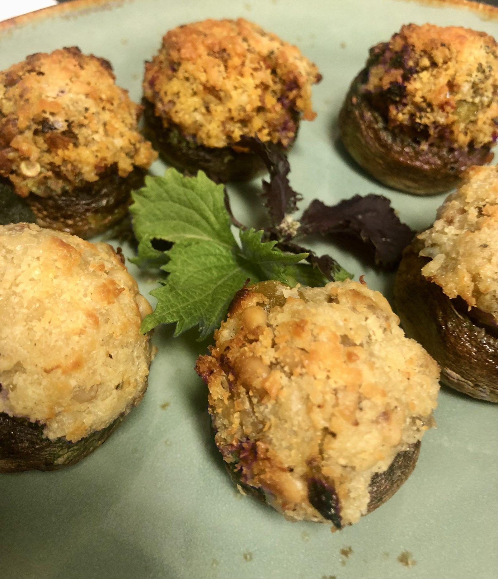 Close-up of stuffed mushroom appetizers prepared for a corporate event